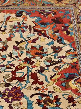 A RUG. An antique silk Kashan so called Motachem. 202,5 x 136,5 cm.