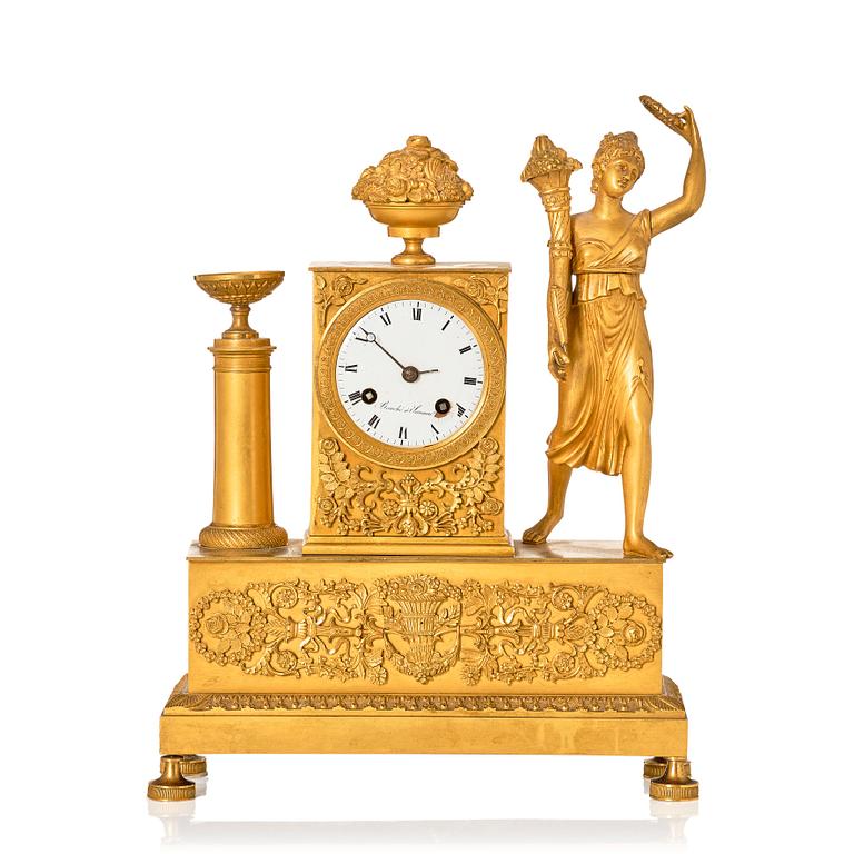 An Empire ormolu figural mantel clock, early 19th century.