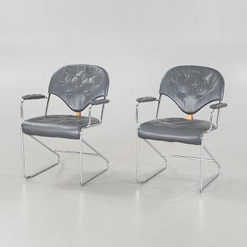 A pair of chairs by Sam Larsson for Dux, designed in 1974.