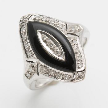 RING, 18K vitguld, besatt med små diamanter samt svart sten.
