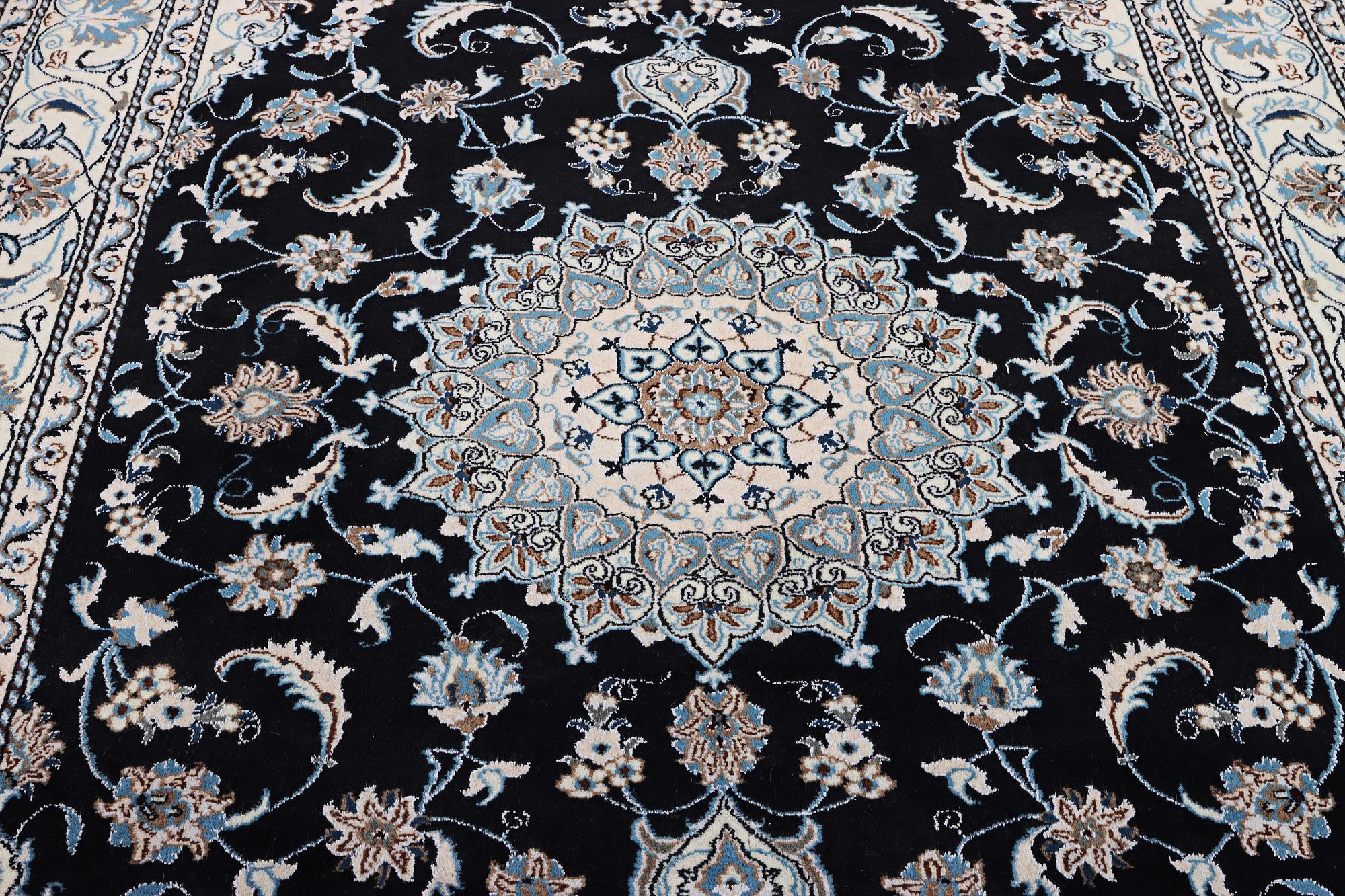 A Nain carpet, part silk, c. 286 x 206 cm.