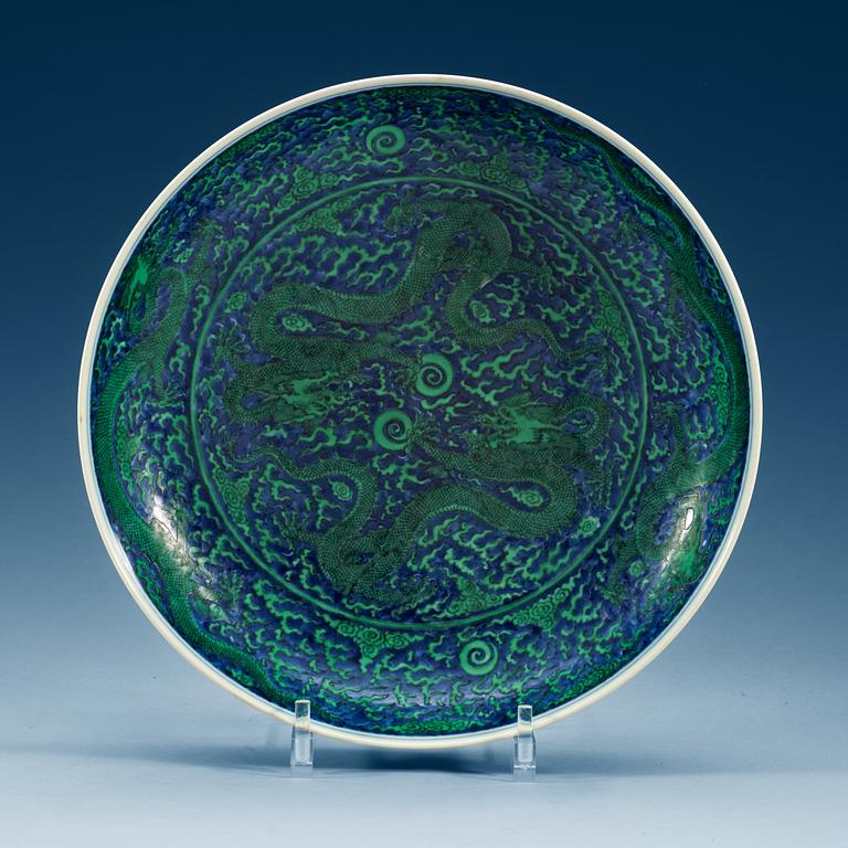 A large green enamelled blue and white dragon dish, Qing dynasty with Kangxi's six character mark.