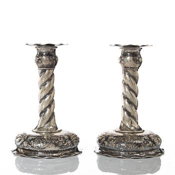 A pair of Baroque style silver candlesticks, marks of CG Hallberg, Stockholm 1942.