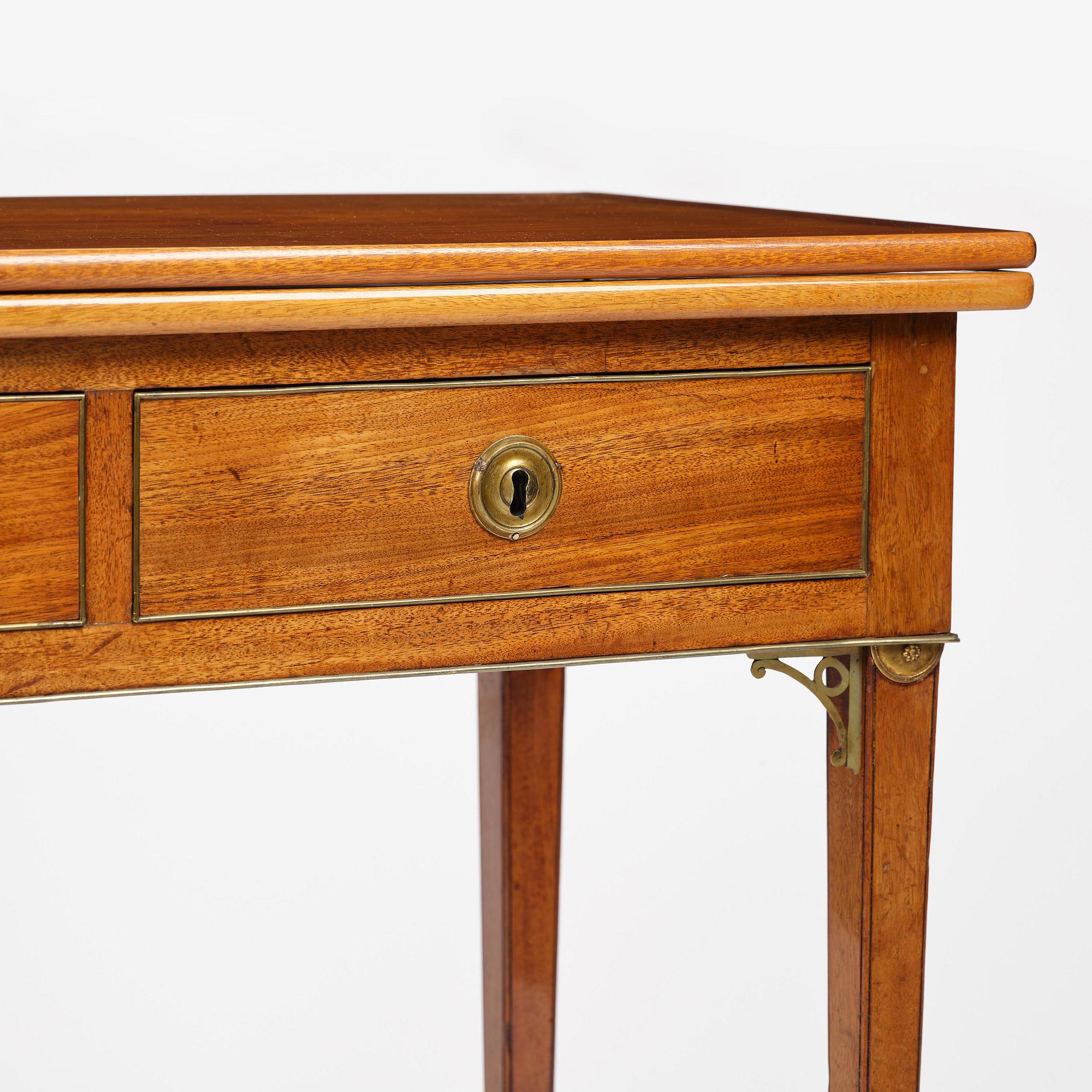 A late Gustavian mahogany games table, presumably by A. Nordström (Journeyman at G. Iwersson 1806-09).