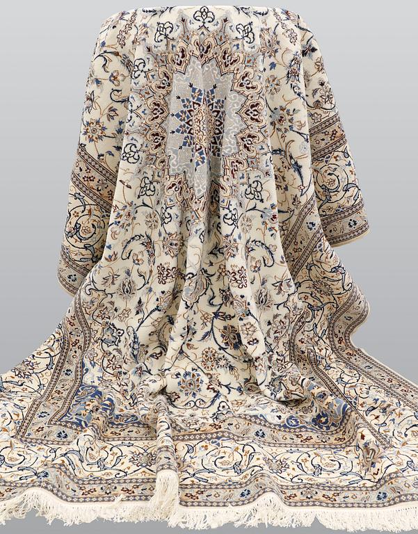 A carpet, Nain part silk s.k 9LAA, ca 355 x 260 cm.
