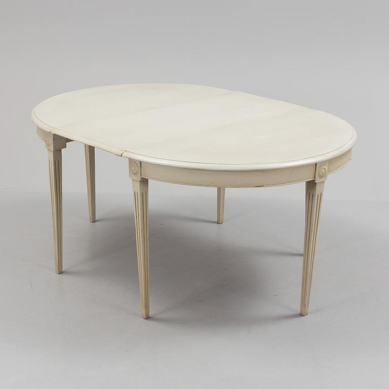 A lot of four mid 20th century Swedish Gustavian style chairs and one dinner table from around year 1900.