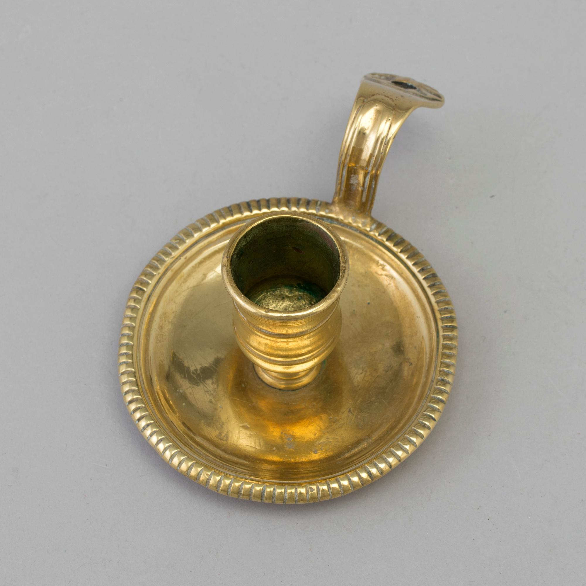 AN 18TH CENTURY BRONZE NIGHT LIGHT.