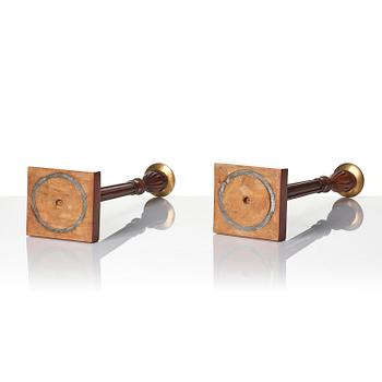 A pair of George III mahogany candlesticks, circa 1800.