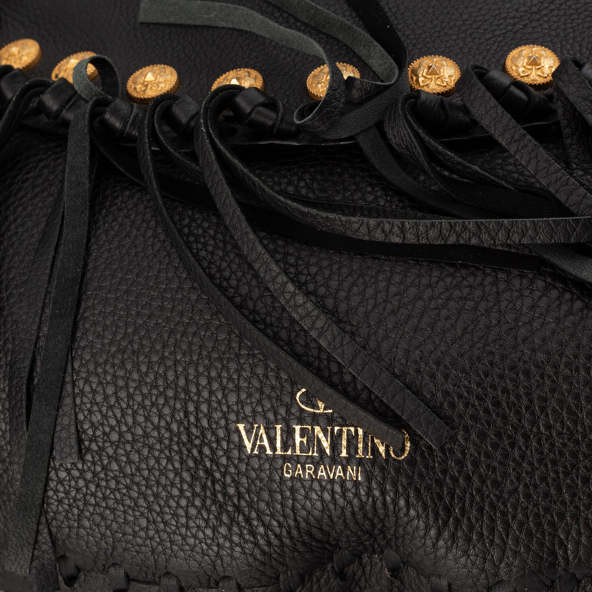 Valentino, a black leather hobo bag.