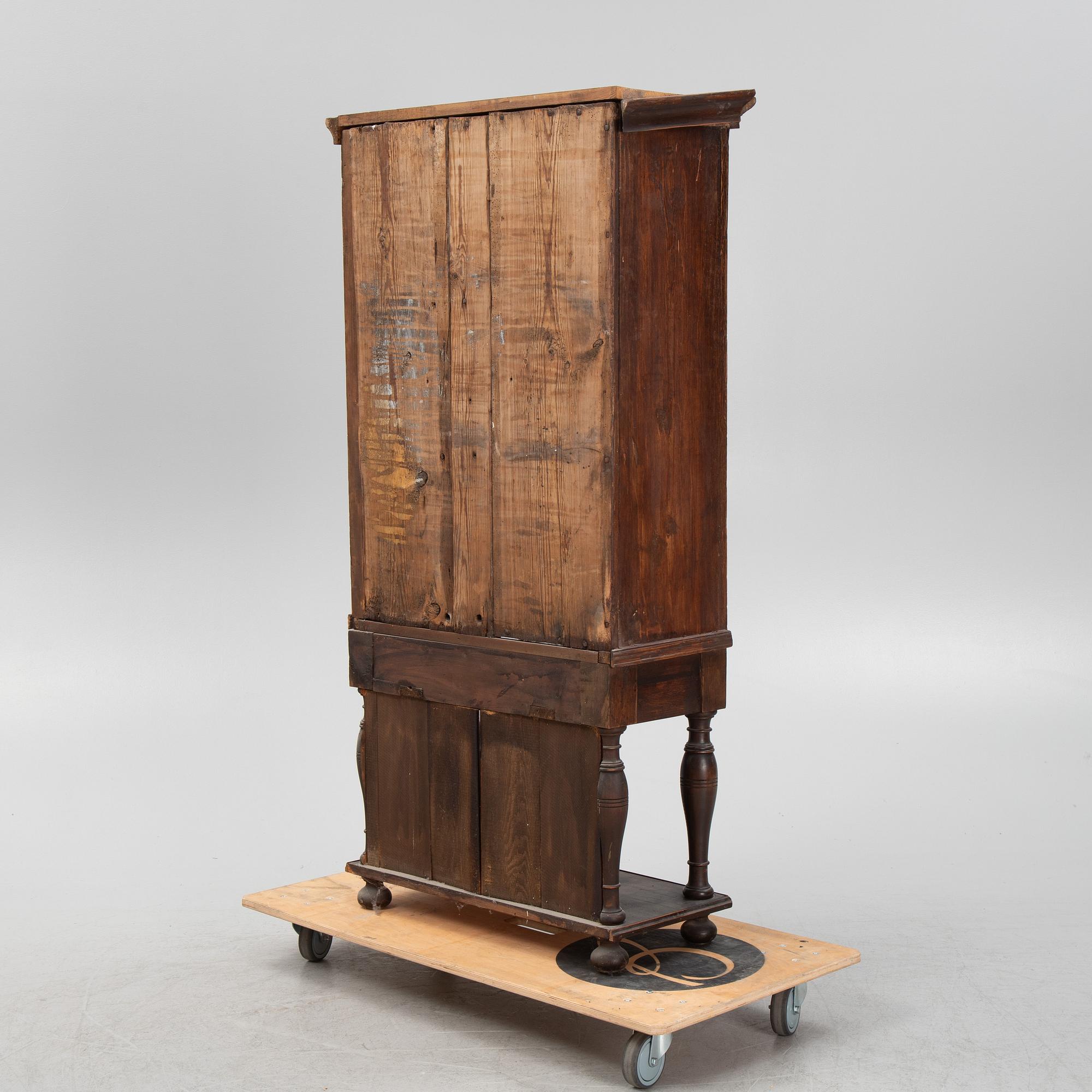 A Baroque cabinet on a later stand, early 18th Century.