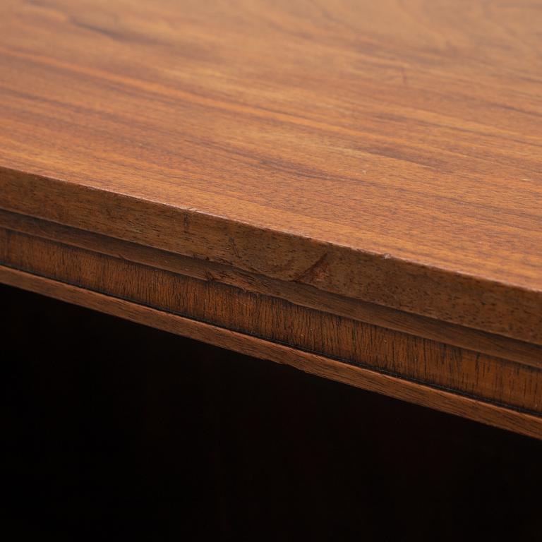 A 1930s wanlut and rosewood veneered  bookcase.