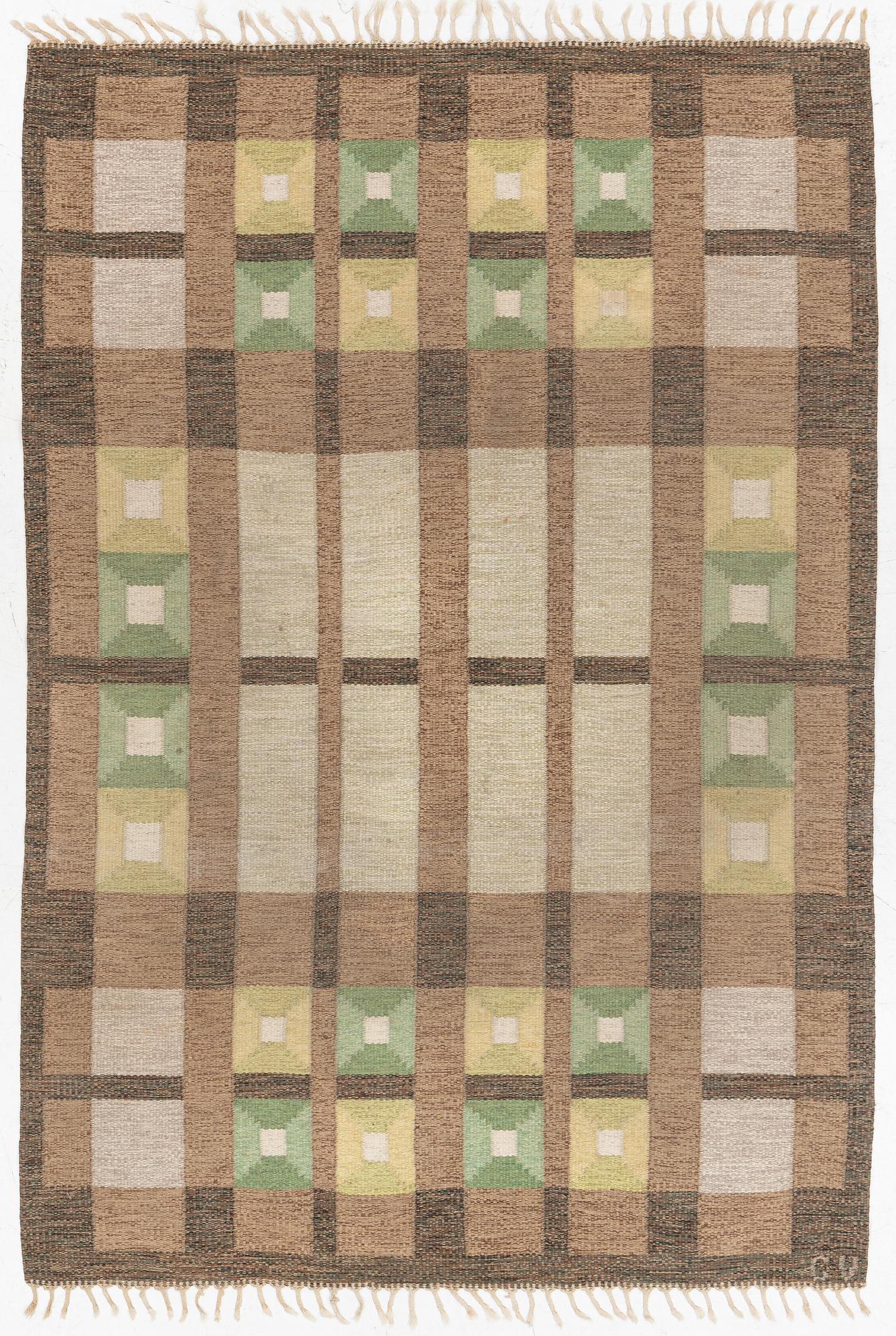 A flat weave carpet, signed, ca. 243 x 165 cm.