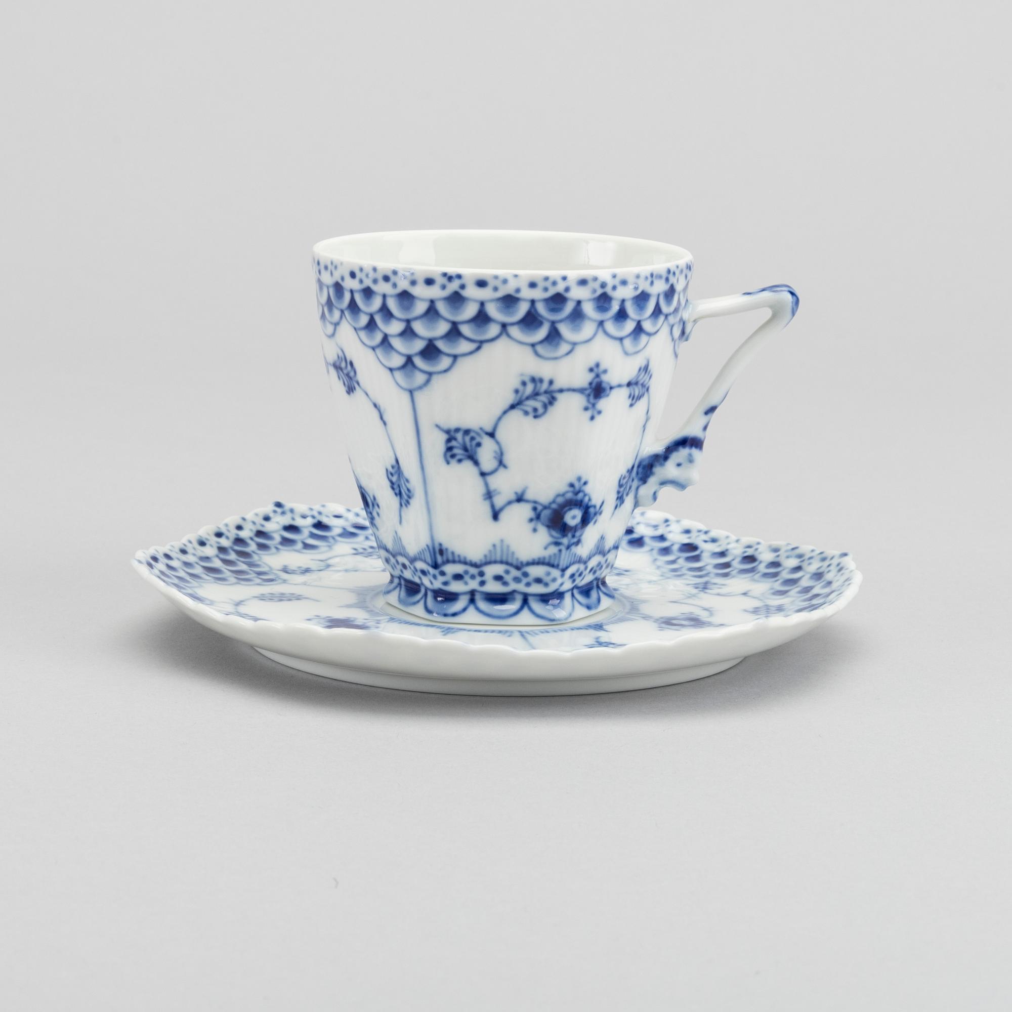 A set of 17 porcelain chocolat cups and saucers Musselmalet Royal Copenhagen Denmark.