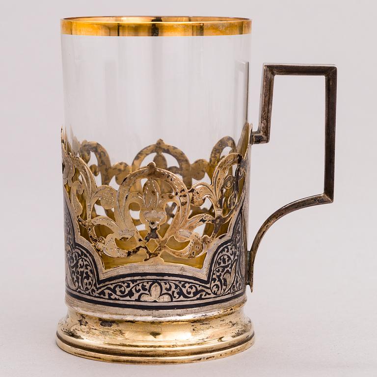 A Russian silver teaglass holder and seven teaspoons, Moscow and Kiev, first half and mid-20th Century.