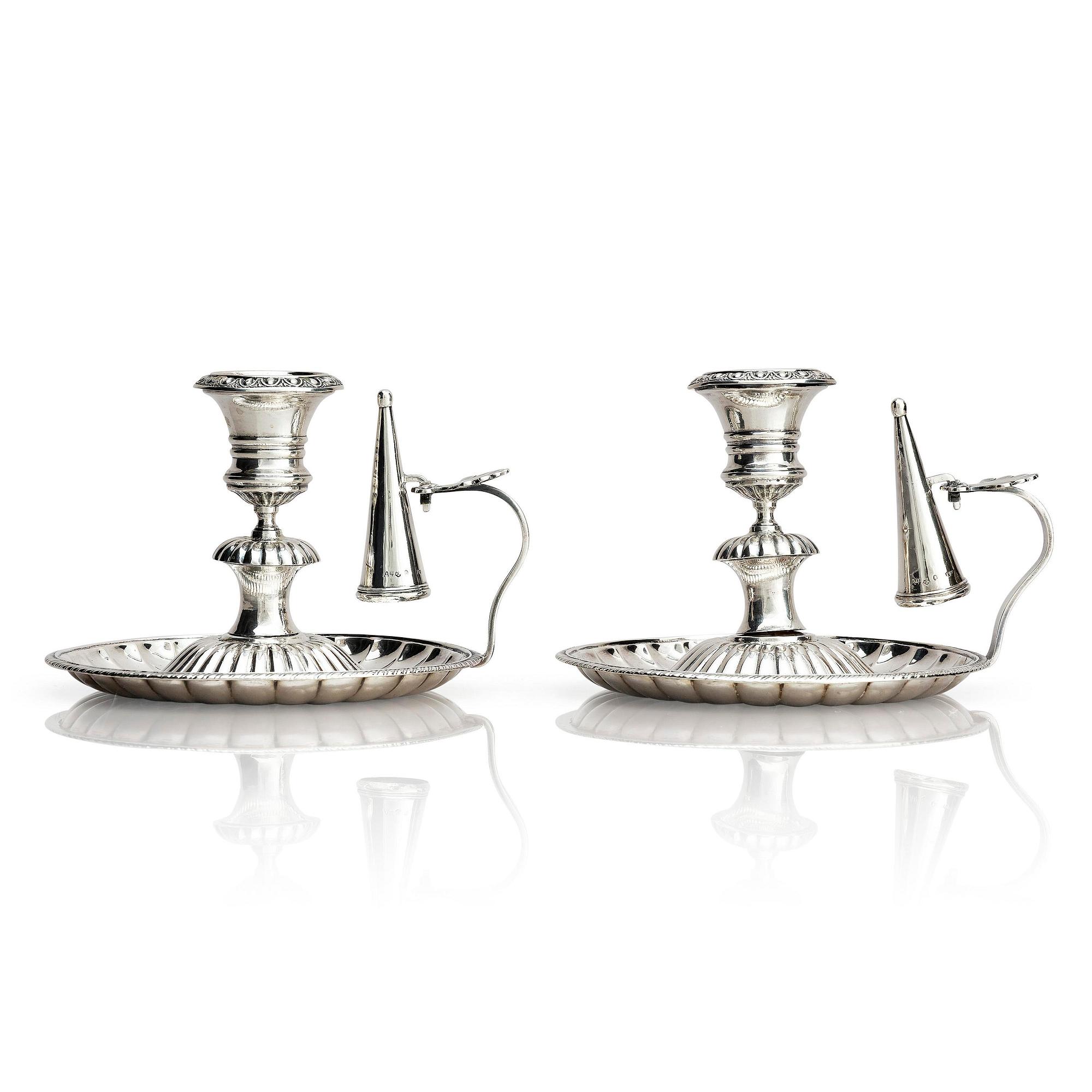 A pair of Swedish 19th century silver chamber-candlesticks, marks of Adolf Zethelius, Stockholm 1831.