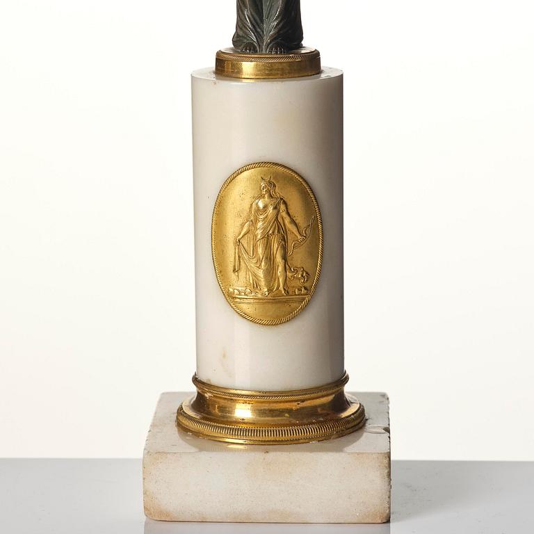 A pair of late Gustavian white marble and bronze candelabra.
