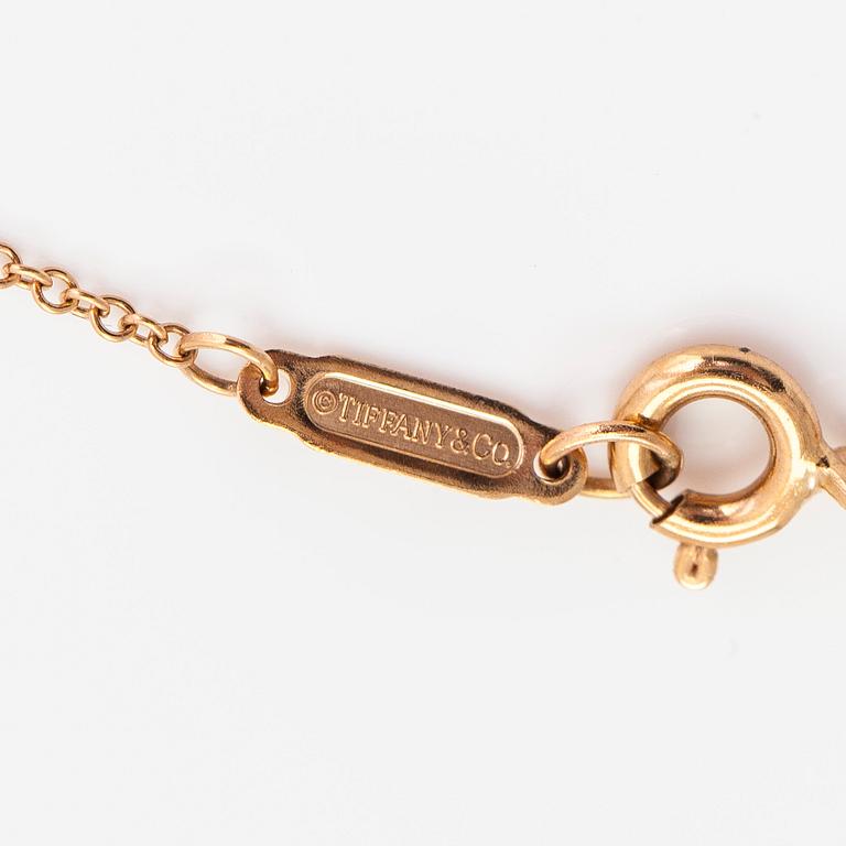 Tiffany & Co,  halsband, 18K guld och briljantslipad diamant ca 0.17 ct.