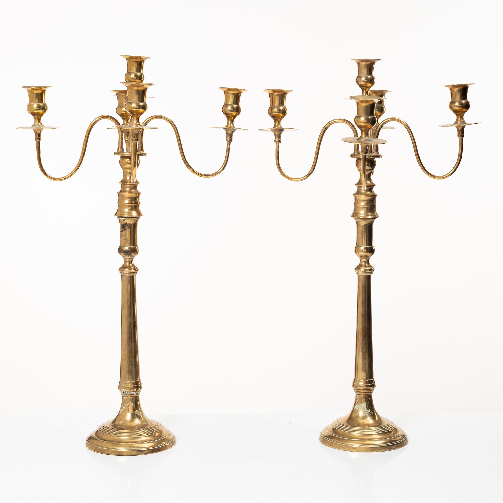 A pair of brass candelabra, model N12, Nyköpings Bruk, Sweden, around 1900.