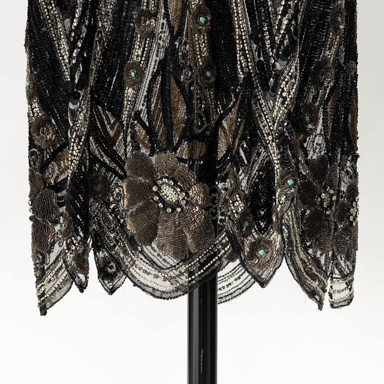 A sequin and pearl-embroidered 1920's dress.