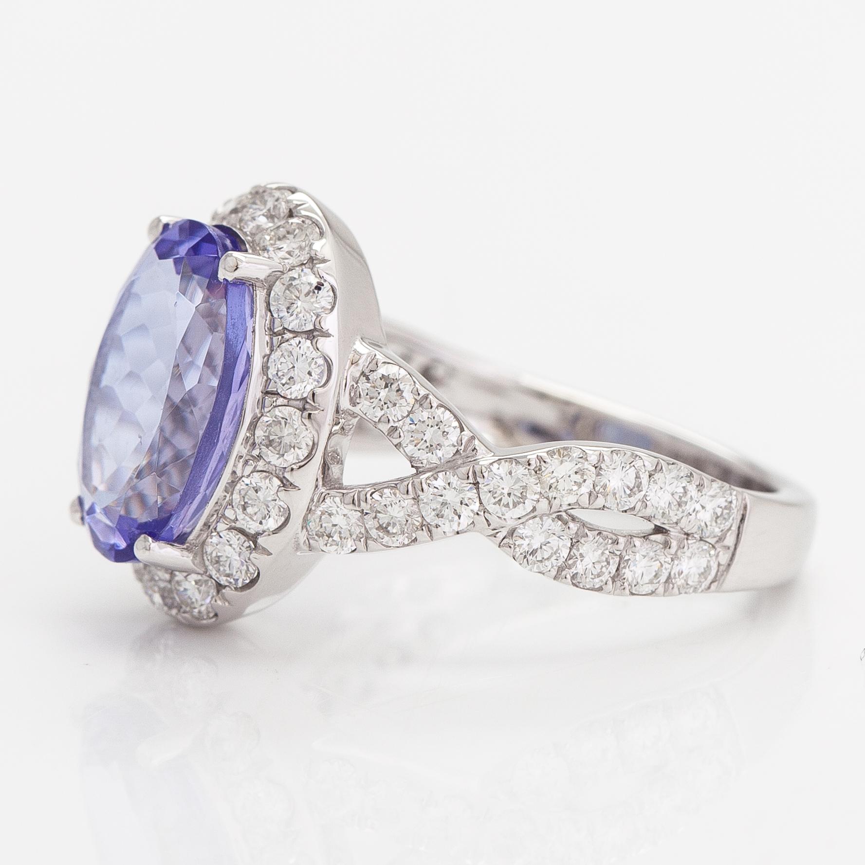 An 18K white gold ring with a ca. 3.45 ct tanzanite and diamonds ca 1.53 ct in total. IGI certificate.