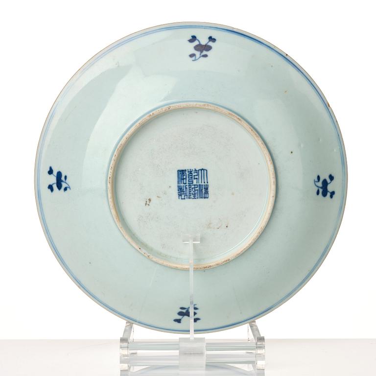 A blue and white dish with immortals and boys, late Qing dynasty, circa 1900.