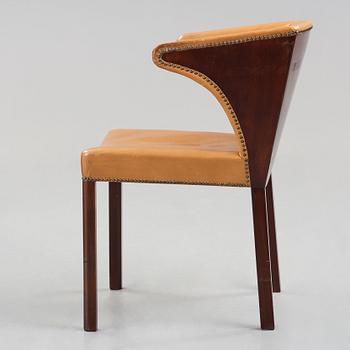 Frits Henningsen, a stained mahogany and brown leather armchair, Denmark.