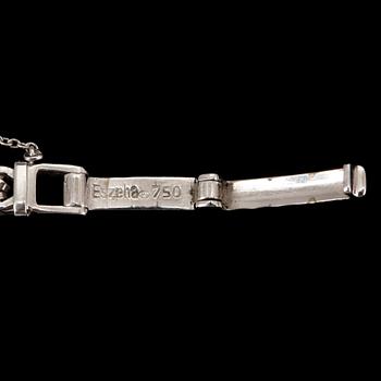 DAMARMBANDSUR, vitguld 18K, med 22 diamanter. Baume & Mercier, Geneve. Svensk importstämpel. Tot ca 21 gram.