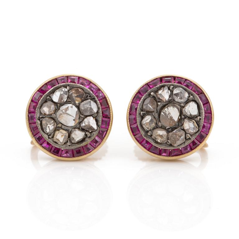 A pair of step cut ruby and rose cut diamond earrings.