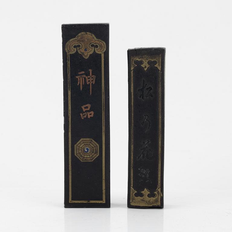 A set of four stone scholars objects, two inksticks and an enameled silver box with cover, Qing dynasty, circa 1900.