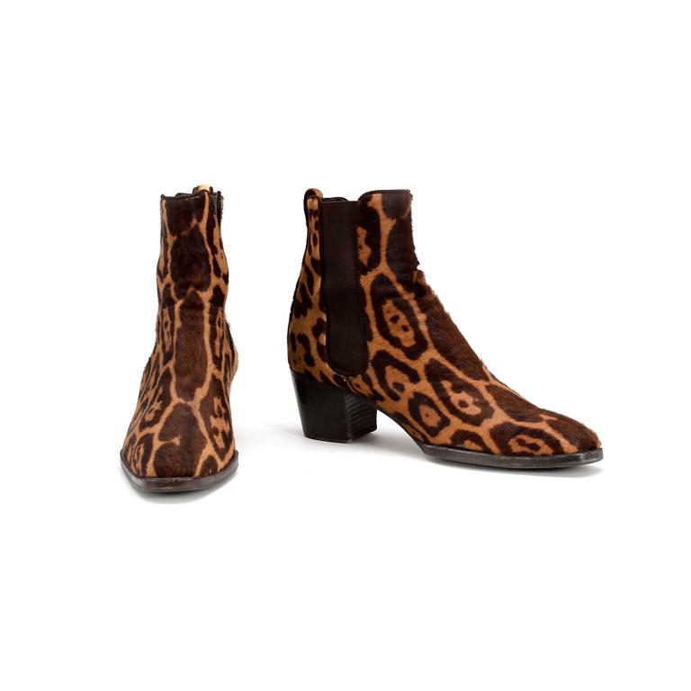 YVES SAINT LAURENT,  a pair of leopard leather boots.
