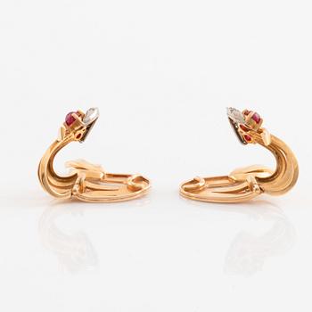 A pair of 18K gold WA Bolin earrings set with cabochon-cut rubies and eight-cut diamonds.