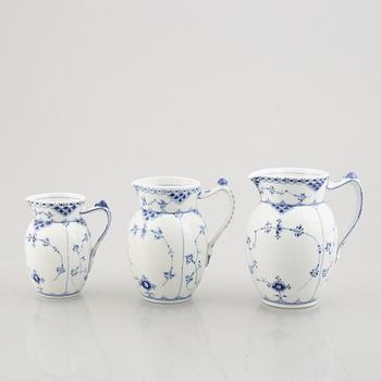 Three 'Blue Fluted Half Lace' / 'Musselmalet' porcelain jugs, Royal Copenhagen, model 562, 561, 763, 1898-1923 and 1962.