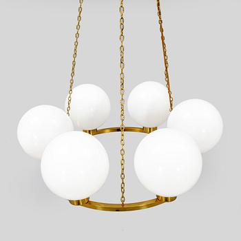 A mid 1900s brass ceiling ceiling pendant.
