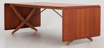 A Hans J Wegner teak and oak sabre leg dinner table by Andreas Tuck, Denmark 1950-60's.
