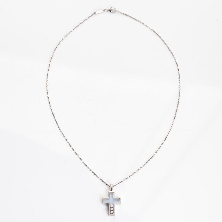 Chopard, an 18K whitegold 'Happy Diamonds" cross necklace set with diamonds.