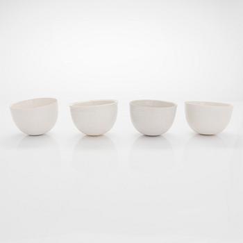 Kyllikki Salmenhaara, four  stoneware cups unclearly stamped signed and two wooden trays.