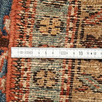 A Heriz runner, ca 310 x 85 cm.