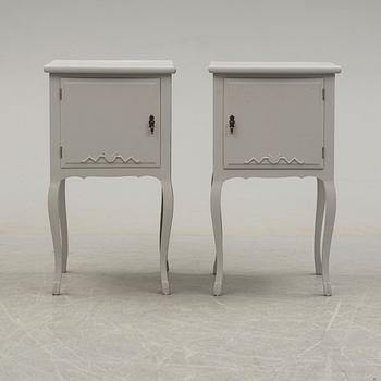 A pair of 20th century Rococo style bed side tables.