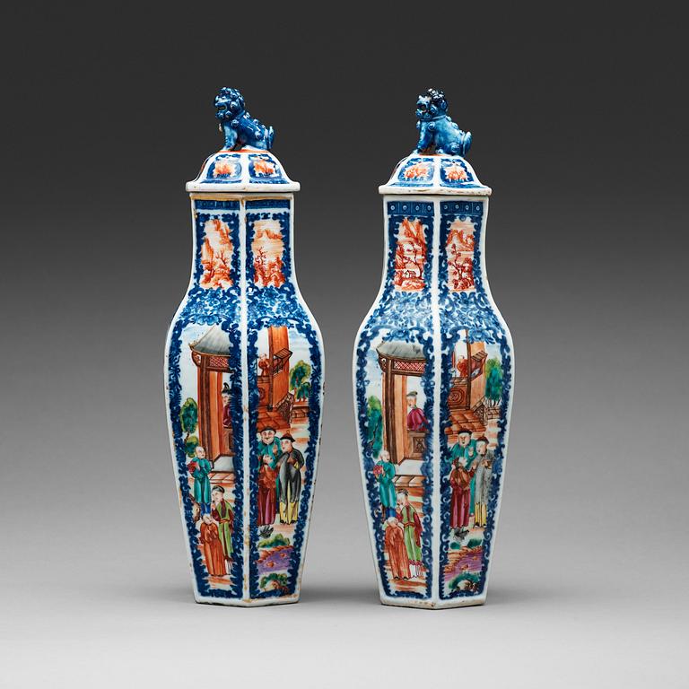 A pair of famille rose and underglaze blue vases with covers, Qing dynasty, Qianlong (1736-95).