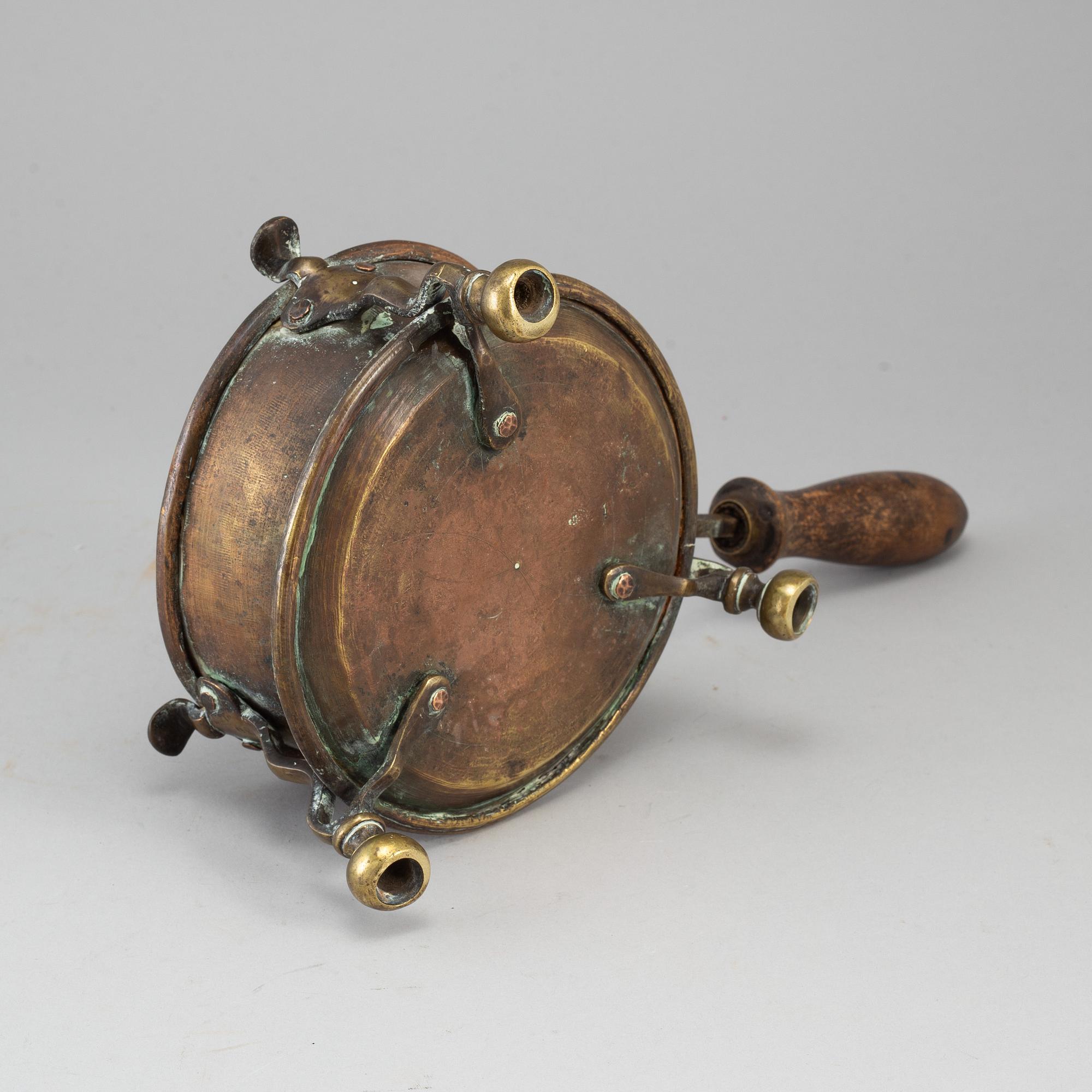 An 18th century brass brazier.