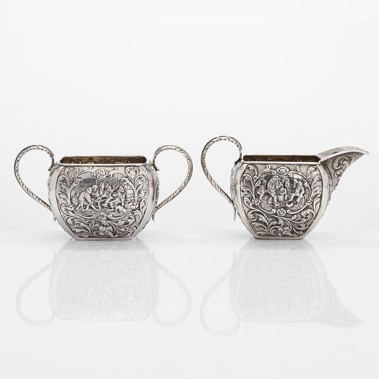 A 1940s Dutch silver sugar bowl and cream jug on a tray, Amsterdam, 1947 and 1942.
