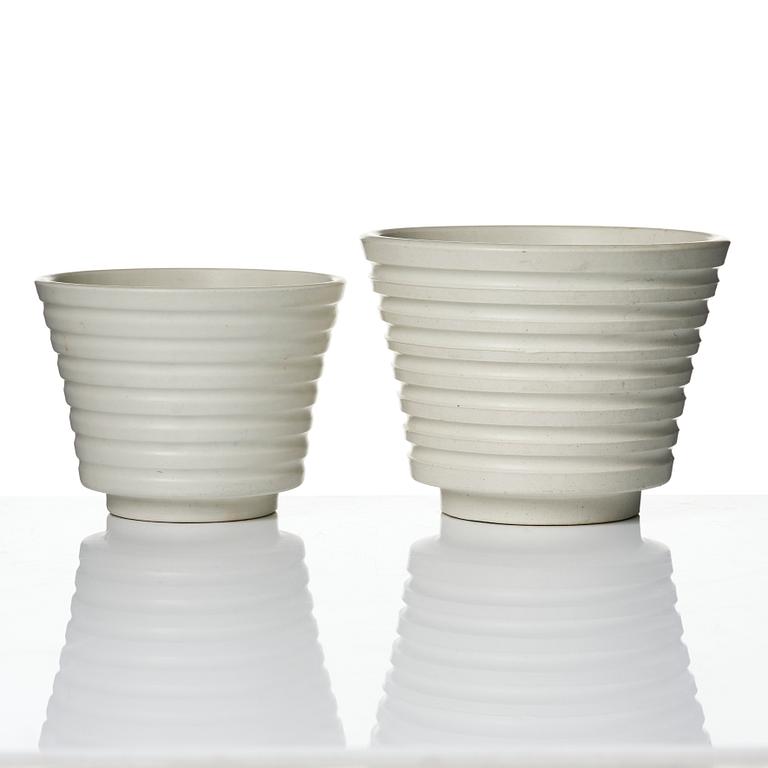Wilhelm Kåge, A set of three ceramic flower pots, a vase and jar with lid,  Gustavsberg 1930s.