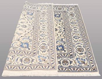 A rug, Nain part silk, ca 197 x 197 cm.