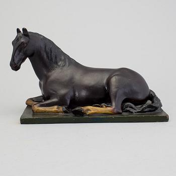 A papier mache horse signed and dated 1799.