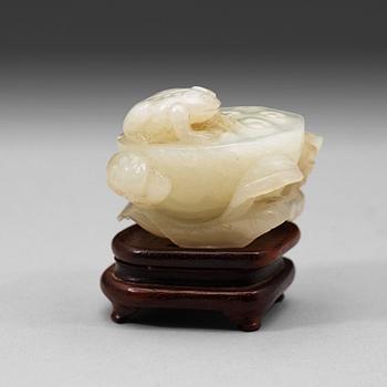 289. A pale celadon nephrite carving of a lotus pod, Qing dynasty (1644-1912).