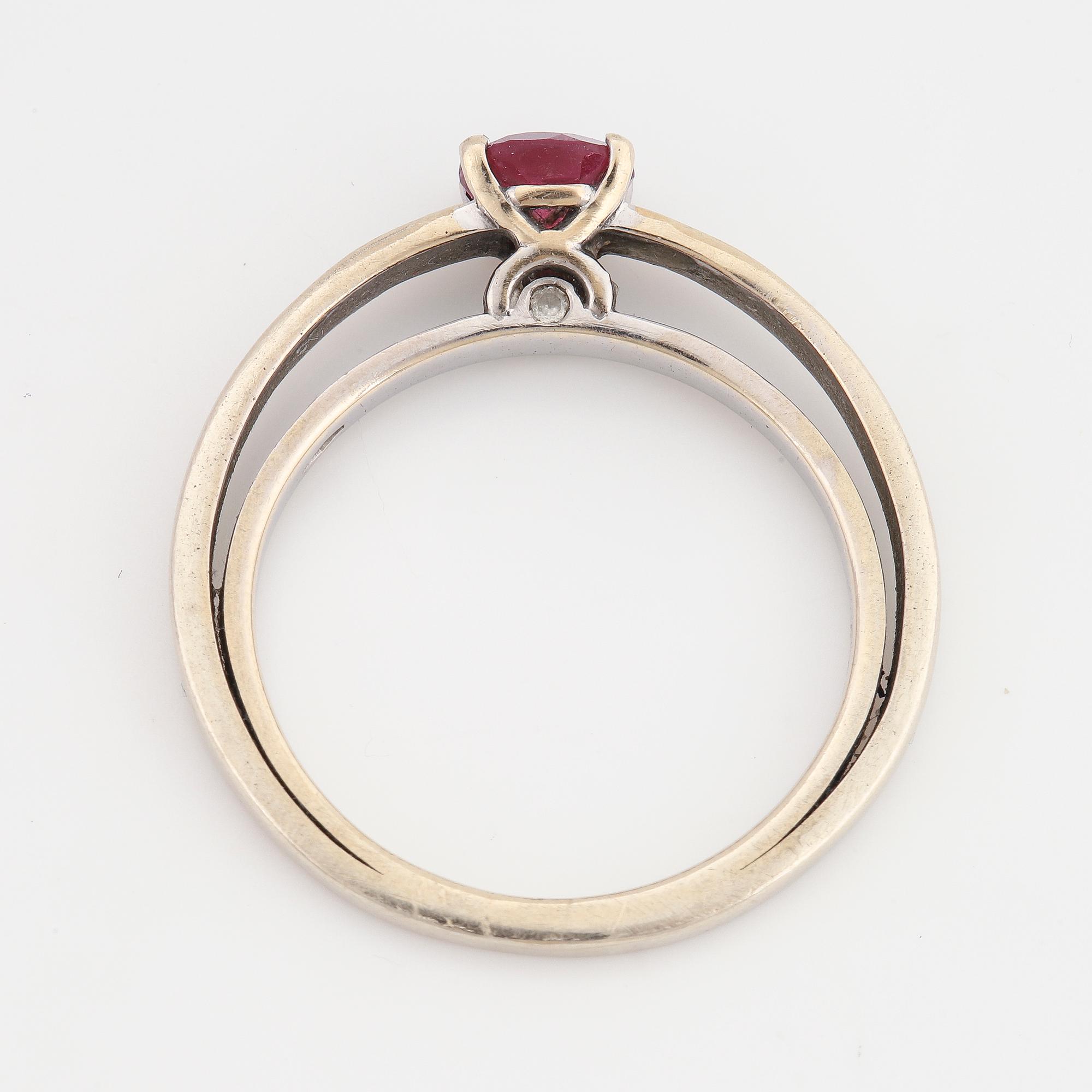 A tourmaline and brilliant cut diamond ring.