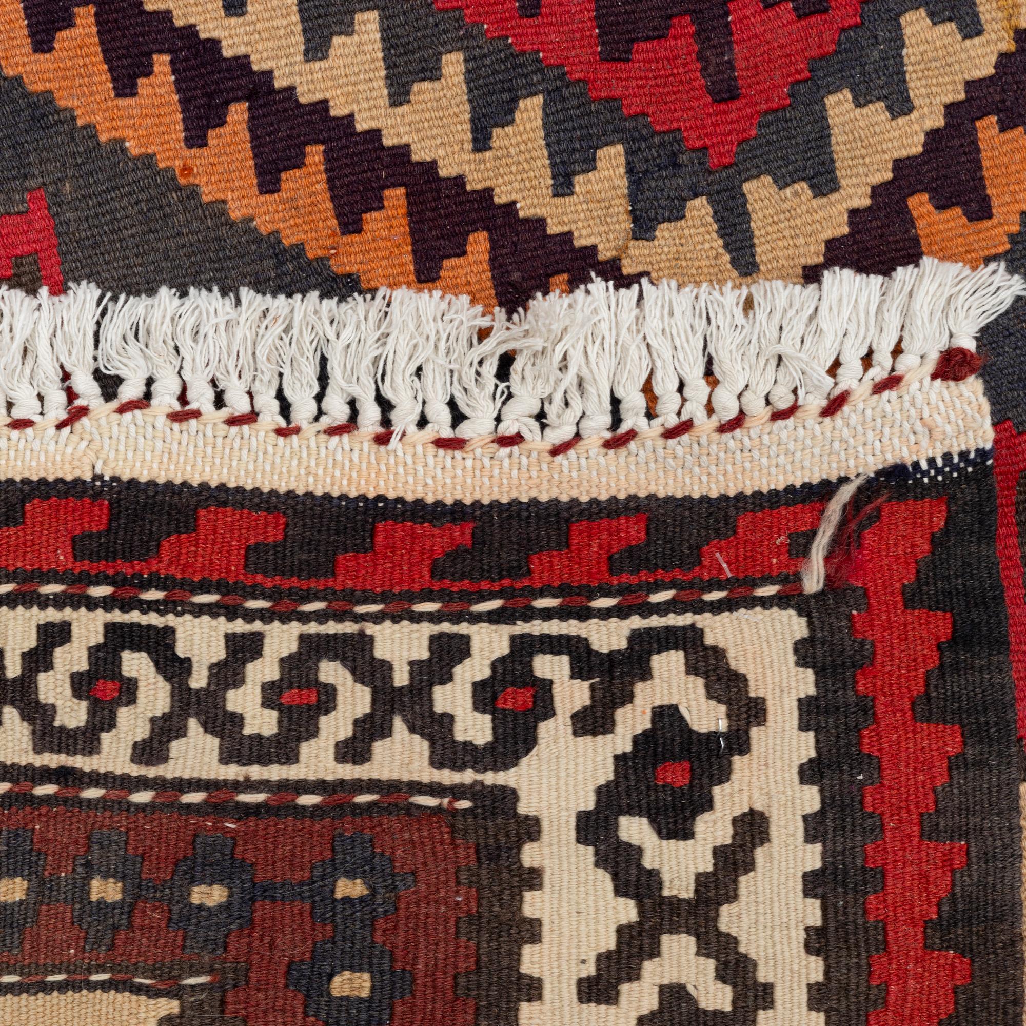 A Kilim carpet, c. 300 x 170 cm.