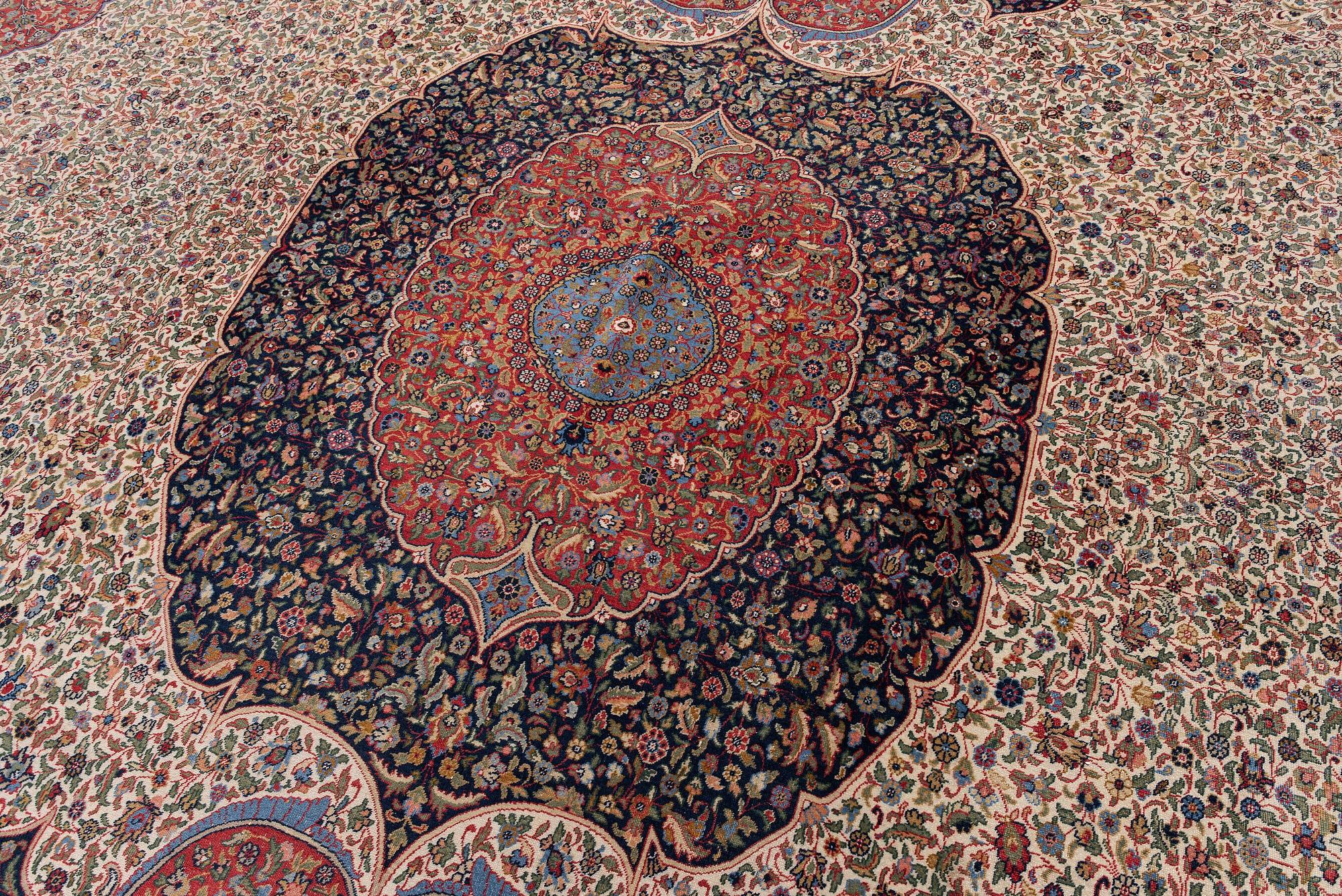 A semi-antique Hereke carpet, Western Turkey, c. 685 x 489 cm.
