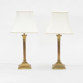 A pair of brass Empire style table lamps, 20th Century.