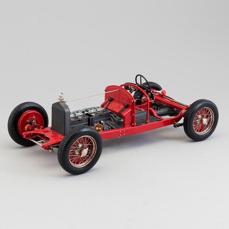 A plastic and metal model of an 1931 Alfa Romeo 8 C by Pocher.